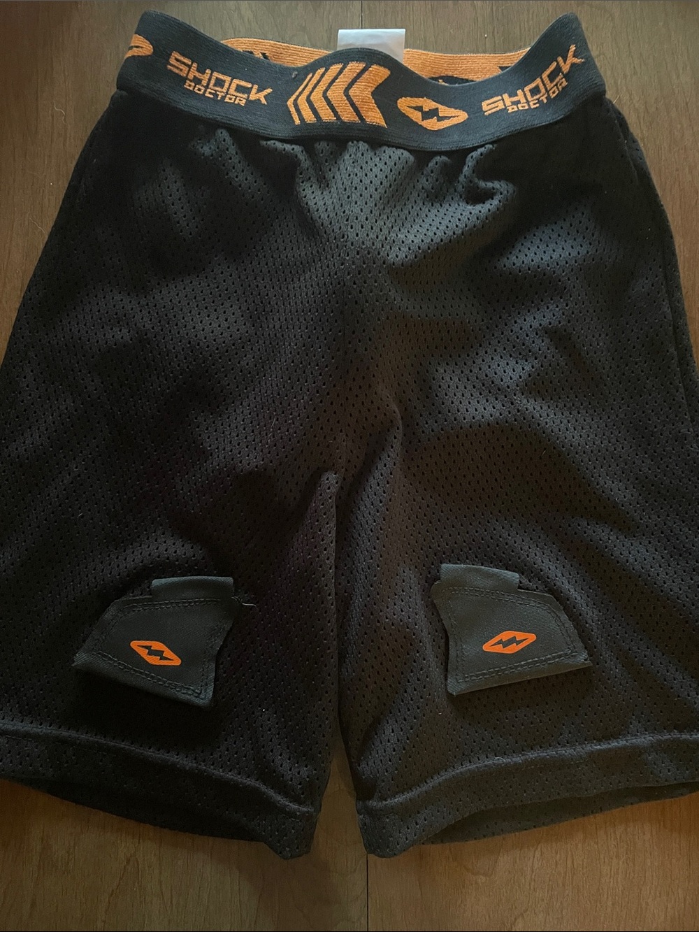 Shock Doctor Boys XS mesh Hockey Shorts with Orange Accents